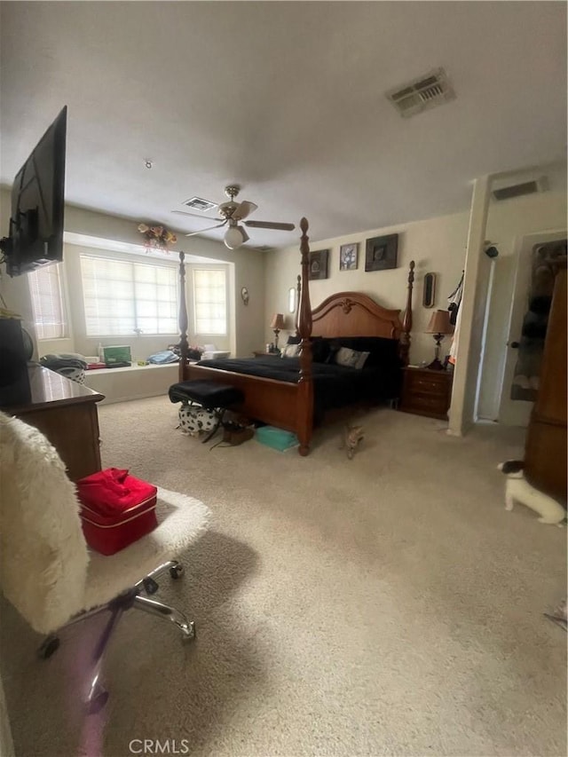 bedroom featuring carpet flooring, a ceiling fan, and visible vents