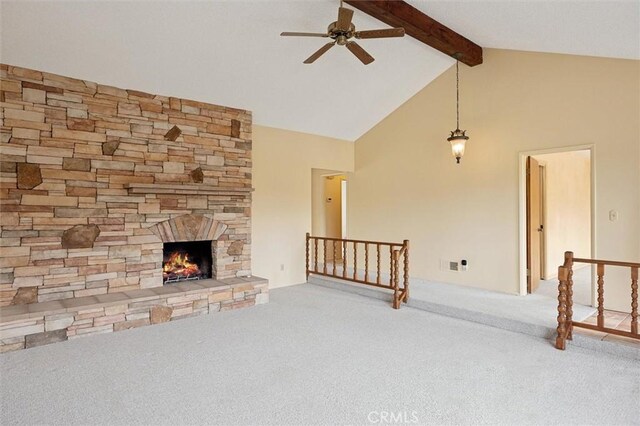2132 El Dorado St, Los Osos, CA 93402 - unfurnished living room featuring carpet floors, a ceiling fan, beamed ceiling, a stone fireplace, and high vaulted ceiling