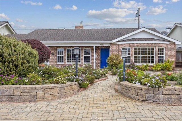 2132 El Dorado St, Los Osos, CA 93402 - ranch-style house with brick siding, a chimney, and a shingled roof