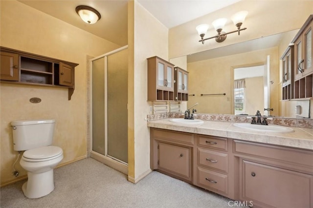 2132 El Dorado St, Los Osos, CA 93402 - bathroom with double vanity, a sink, a stall shower, and toilet
