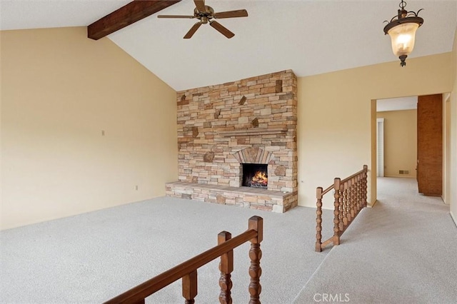 2132 El Dorado St, Los Osos, CA 93402 - living room with ceiling fan, light carpet, a stone fireplace, vaulted ceiling with beams, and visible vents
