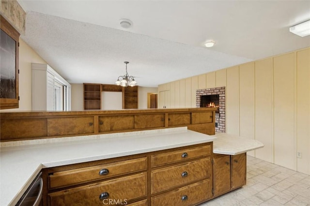 2132 El Dorado St, Los Osos, CA 93402 - kitchen with a chandelier, light countertops, decorative light fixtures, and brown cabinets