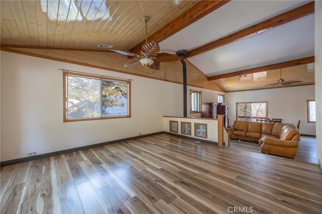 living area featuring vaulted ceiling with beams, ceiling fan, and wood finished floors