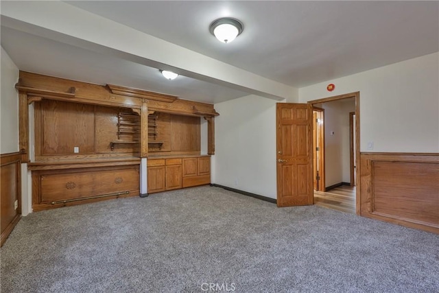 unfurnished living room featuring light colored carpet