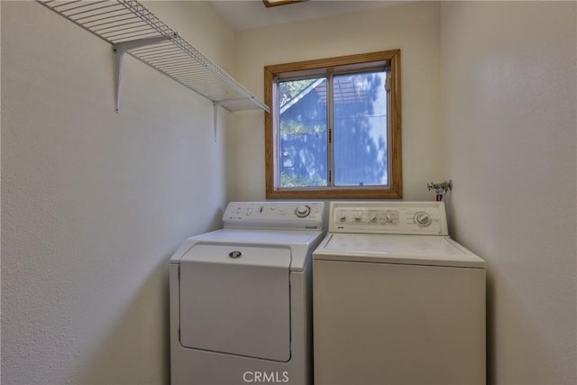 clothes washing area with laundry area and washing machine and dryer