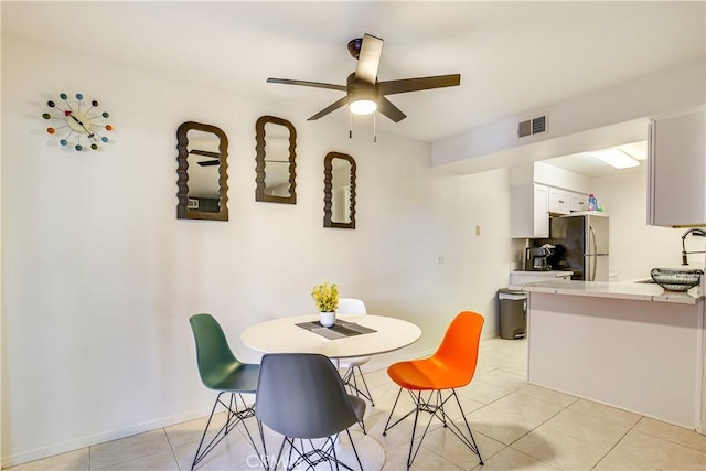 1100 E Amado Rd Unit 11A1, Palm Springs, CA 92262 - dining space featuring light tile patterned floors and ceiling fan