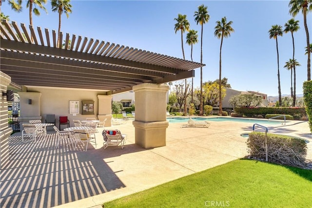 1100 E Amado Rd Unit 11A1, Palm Springs, CA 92262 - view of patio / terrace with a pergola and a community pool