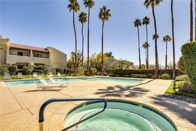 1100 E Amado Rd Unit 11A1, Palm Springs, CA 92262 - community pool featuring a hot tub and a patio area