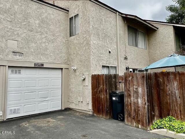 15091 Varsity St Unit C, Moorpark, CA 93021 - view of side of property featuring stucco siding and a garage