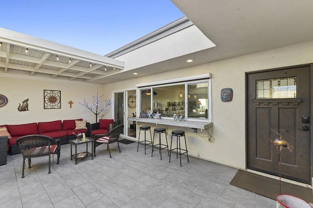 exterior space featuring an outdoor living space and outdoor dry bar