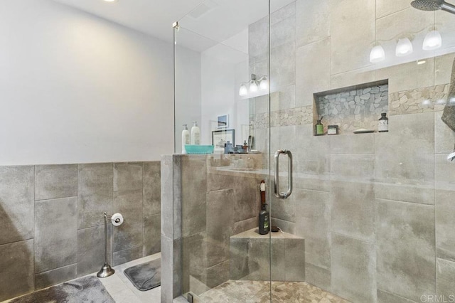 bathroom featuring a shower stall