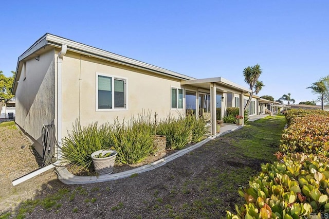 view of property exterior with stucco siding