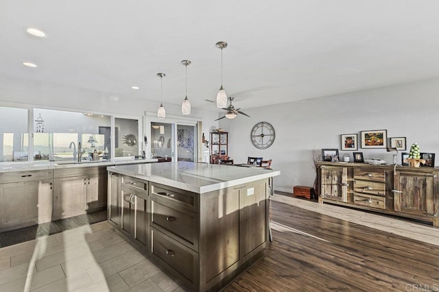 kitchen featuring recessed lighting, ceiling fan, dark wood finished floors, and a sink