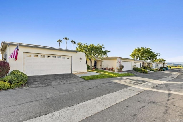 view of front of home featuring a garage and stucco siding
