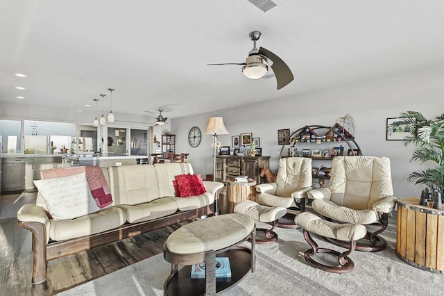 living area with a ceiling fan, visible vents, wood finished floors, and recessed lighting