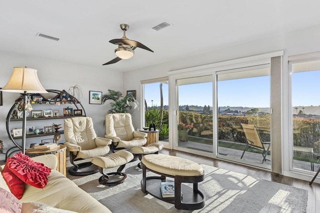 3902 Vista Campana N Unit 12, Oceanside, CA 92057 - living area with hardwood / wood-style flooring and a ceiling fan