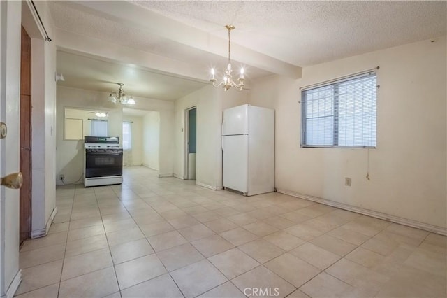 10180 Eddystone St, Riverside, CA 92503 - kitchen with range with gas stovetop, a textured ceiling, a chandelier, and freestanding refrigerator