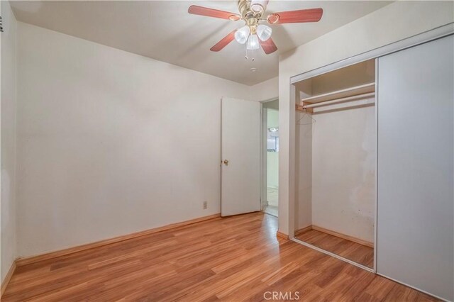 10180 Eddystone St, Riverside, CA 92503 - unfurnished bedroom featuring a closet, a ceiling fan, light wood-style flooring, and baseboards