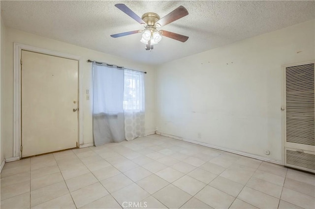10180 Eddystone St, Riverside, CA 92503 - unfurnished room featuring a heating unit, a textured ceiling, a ceiling fan, and light tile patterned flooring