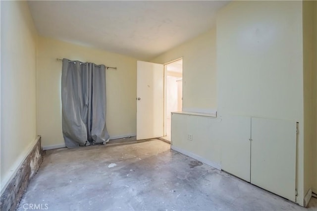 10180 Eddystone St, Riverside, CA 92503 - empty room with unfinished concrete flooring