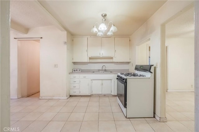 10180 Eddystone St, Riverside, CA 92503 - kitchen featuring light tile patterned flooring, an inviting chandelier, a sink, light countertops, and range with gas cooktop