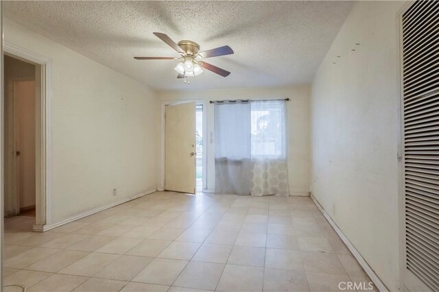10180 Eddystone St, Riverside, CA 92503 - unfurnished room featuring light tile patterned floors, ceiling fan, a textured ceiling, and a heating unit