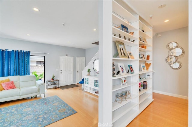 bedroom with recessed lighting, baseboards, and wood finished floors
