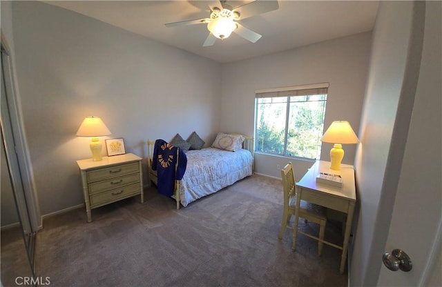 carpeted bedroom with baseboards and a ceiling fan