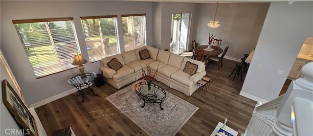 living room featuring wood finished floors and baseboards