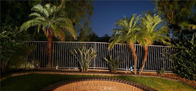 view of gate featuring fence