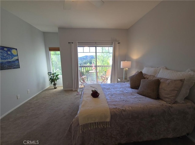 carpeted bedroom featuring baseboards, access to outside, and ceiling fan