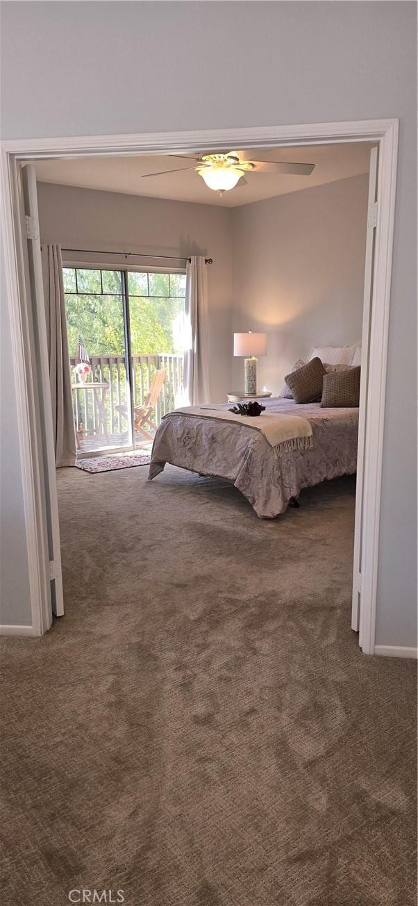 bedroom featuring ceiling fan and carpet flooring