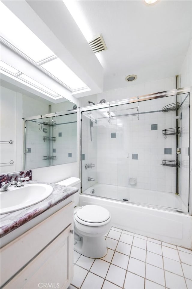 full bath featuring tile patterned flooring, vanity, toilet, enclosed tub / shower combo, and visible vents