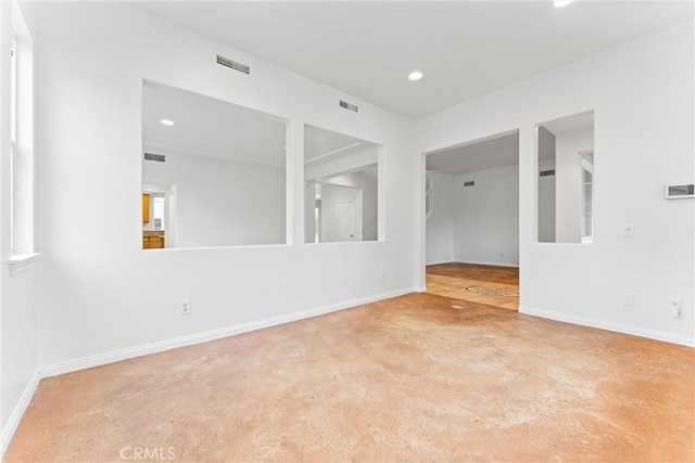 unfurnished room featuring baseboards, recessed lighting, and visible vents