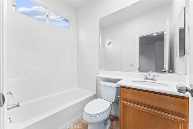 bathroom featuring vanity, bathtub / shower combination, and toilet