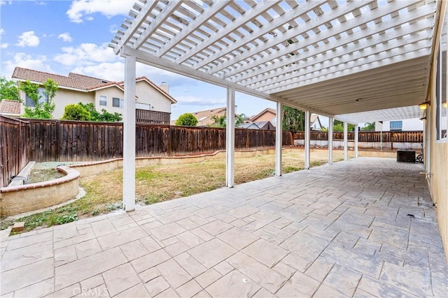 view of patio featuring a pergola and a fenced backyard