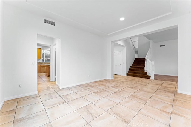 unfurnished living room with visible vents, baseboards, stairway, recessed lighting, and light tile patterned floors