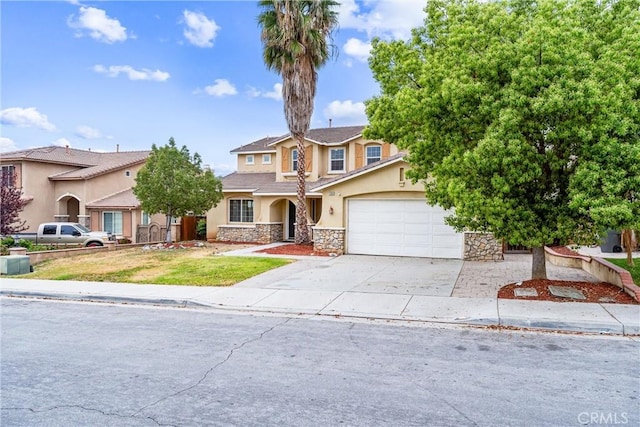 traditional home with concrete driveway, stucco siding, an attached garage, and stone siding