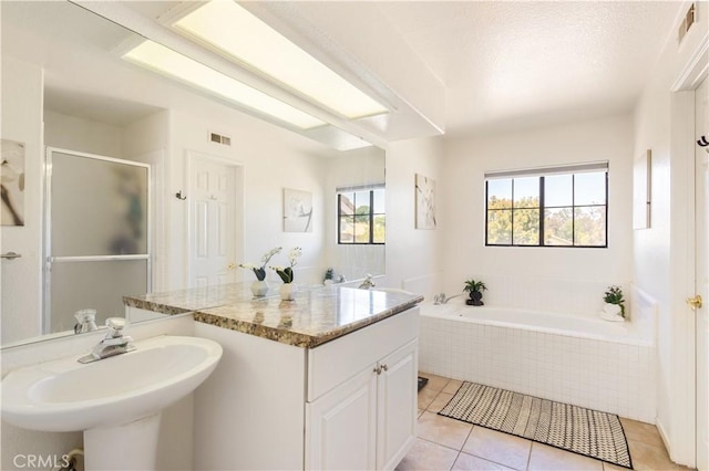 41787 Humber Dr, Temecula, CA 92591 - full bathroom with a sink, a stall shower, tile patterned floors, and a garden tub