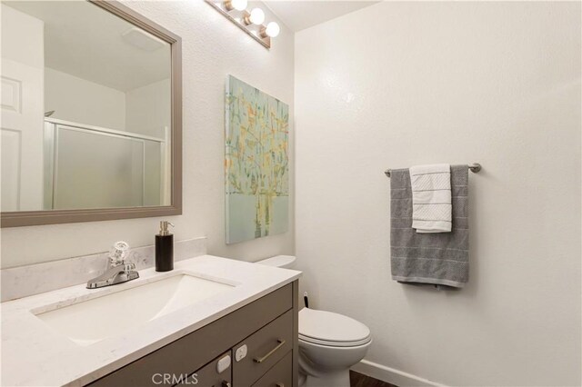41787 Humber Dr, Temecula, CA 92591 - full bathroom with a shower stall, vanity, and toilet