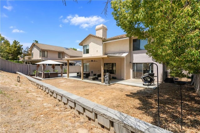 41787 Humber Dr, Temecula, CA 92591 - rear view of house with an outdoor hangout area, stucco siding, a fenced backyard, and a patio area