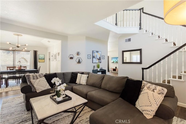 41787 Humber Dr, Temecula, CA 92591 - living area featuring wood finished floors, stairway, and a chandelier