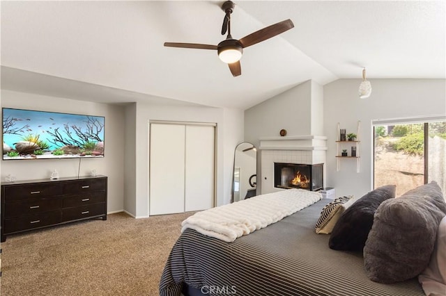 41787 Humber Dr, Temecula, CA 92591 - bedroom with vaulted ceiling, light colored carpet, a closet, a ceiling fan, and a tiled fireplace
