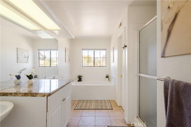 41787 Humber Dr, Temecula, CA 92591 - bathroom with a shower stall, a bath, and tile patterned flooring