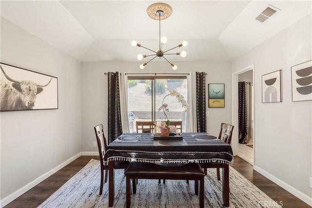 41787 Humber Dr, Temecula, CA 92591 - dining area featuring a chandelier, dark wood-style floors, and baseboards