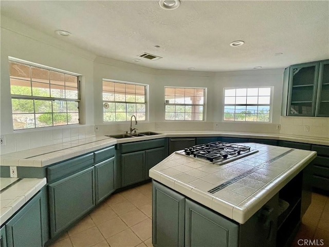 48628 Adeline Way, Morongo Valley, CA 92256 - kitchen featuring green cabinets, visible vents, a sink, and stainless steel gas cooktop