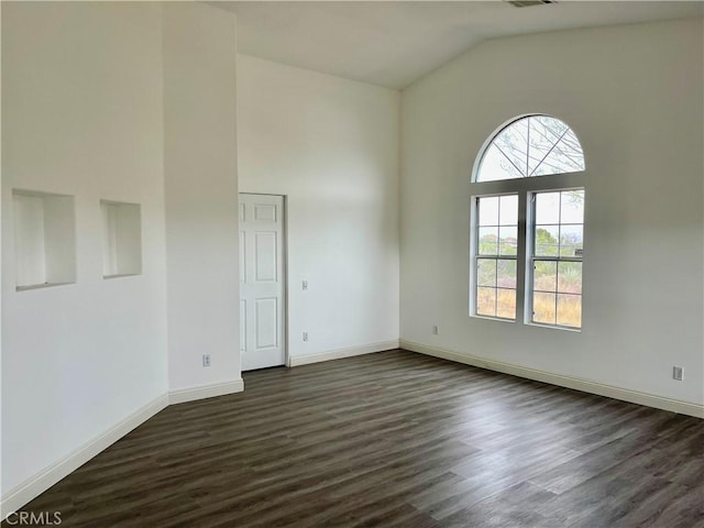 48628 Adeline Way, Morongo Valley, CA 92256 - empty room featuring high vaulted ceiling, baseboards, dark wood-style floors, and visible vents