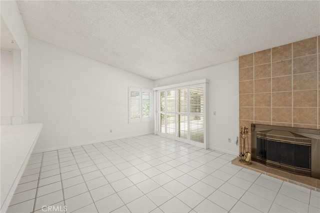 1620 S Cypress Ave, Ontario, CA 91762 - unfurnished living room with a fireplace, a textured ceiling, and tile patterned floors