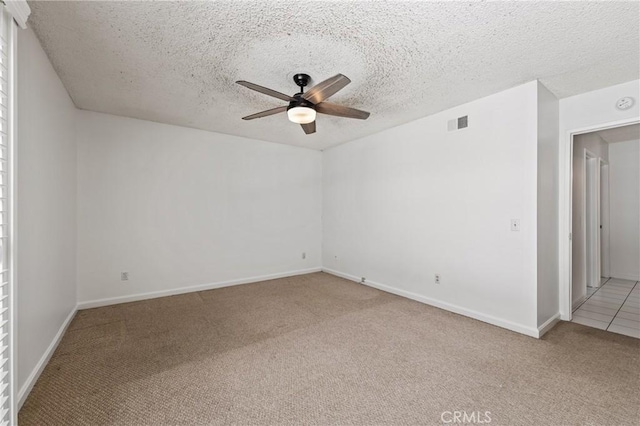 1620 S Cypress Ave, Ontario, CA 91762 - unfurnished room featuring light carpet, ceiling fan, and a textured ceiling