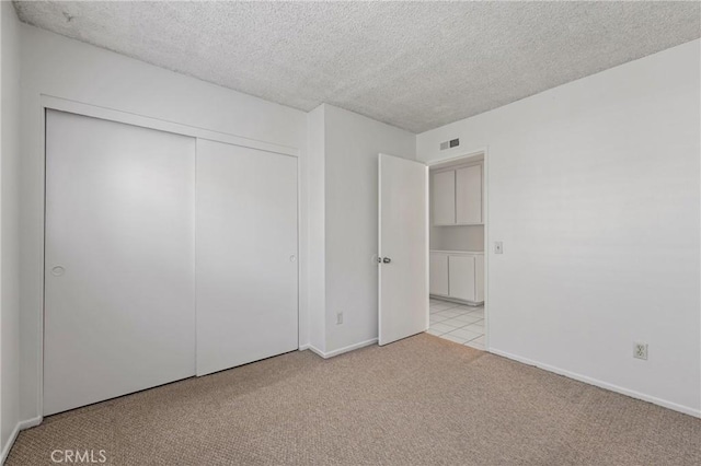1620 S Cypress Ave, Ontario, CA 91762 - unfurnished bedroom featuring carpet floors, a closet, and a textured ceiling